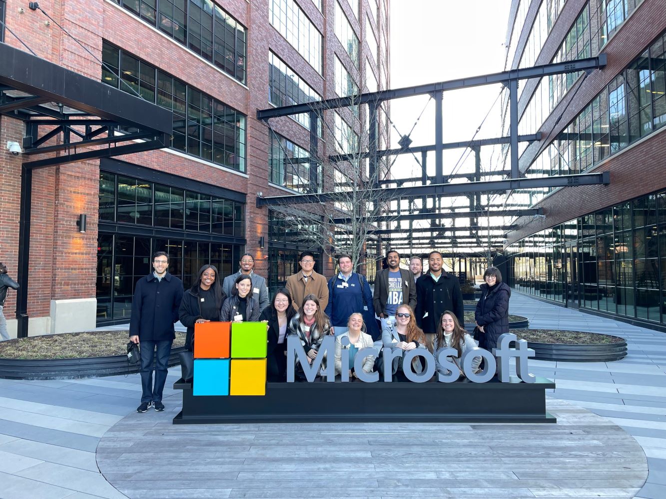Students beside the Microsoft sign