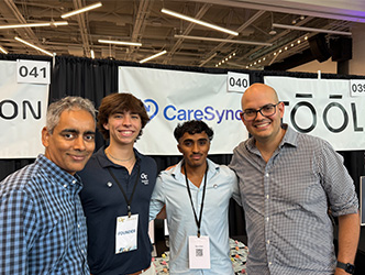 Karthik Ramachandran, Dunn Family Professor of Operations Management; Cooper Ciavola, BSBA ’27; Azan Khan, BSBA ’27; and Andre Calmon, associate professor of Operations Management gather at Georgia Tech’s CREATE-X Demo Day