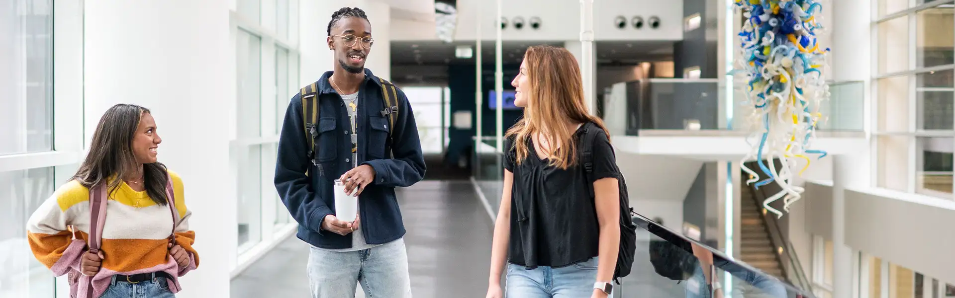 A Group of undergraduate students standing in an atrium