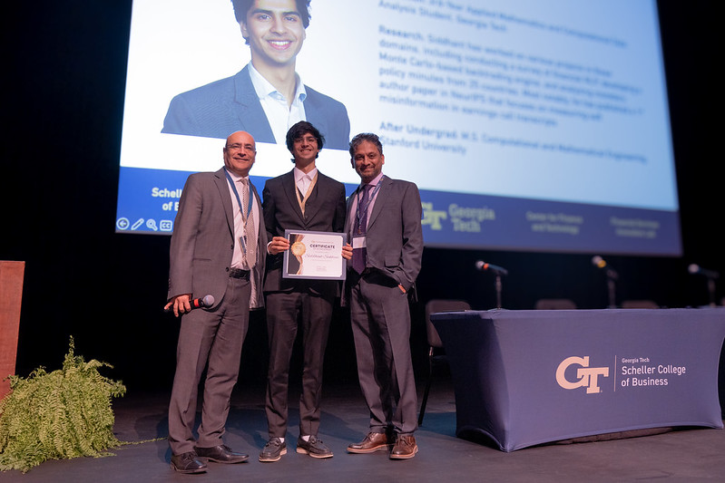 Dean Anuj Mehrotra and Professor Sudheer Chava with a Georgia Tech student