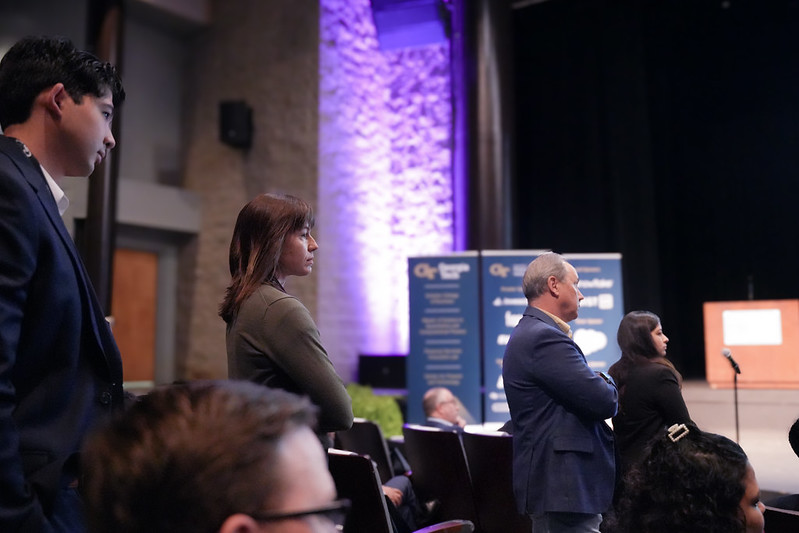 AI and Future of Finance Conference attendees stand in line during a Q&A session