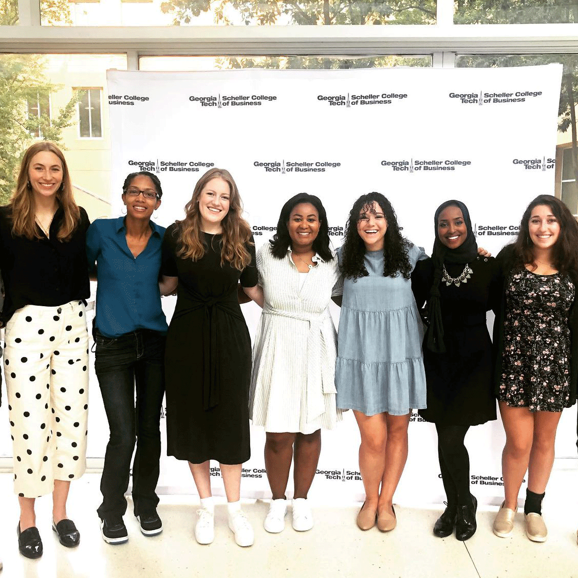 Full-time MBA students standing in the Scheller atrium