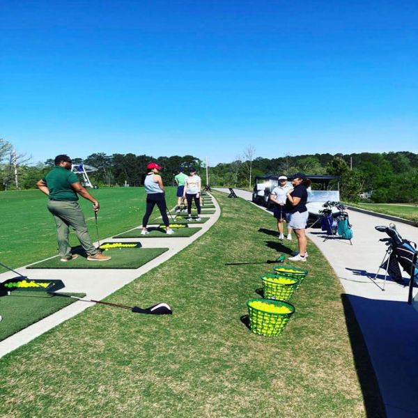 Full-time MBA members attending a Golf Clinic