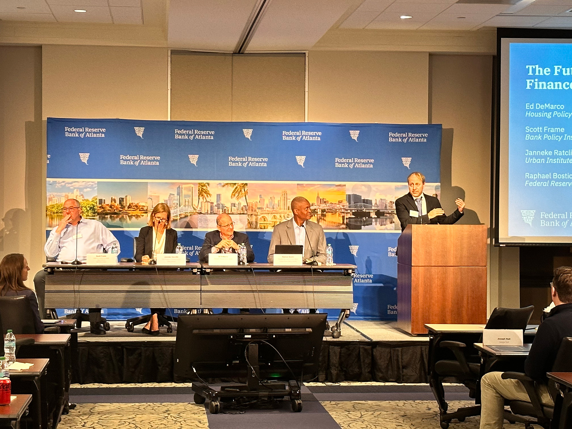 A panel discussion including Scott Frame, Janneke Ratcliffe, Ed DeMarco, and Raphael Bostic.