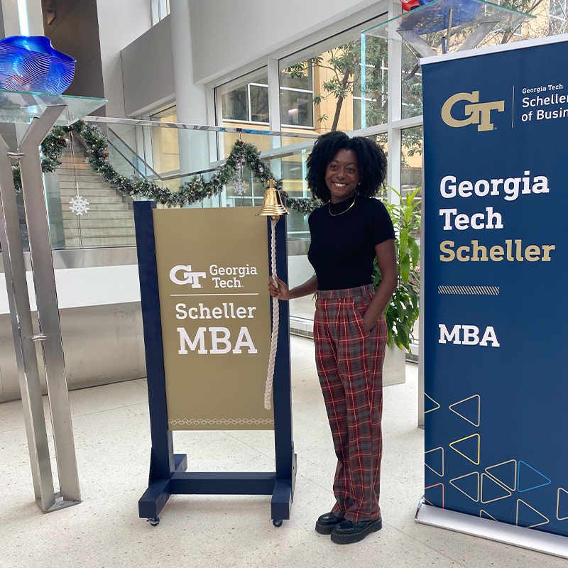 Brianna Thornton rings the bell at the Scheller College of Business to celebrate her new job 