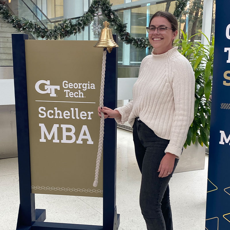 Molly O'Neil rings the bell at the Scheller College of Business to celebrate her new job 