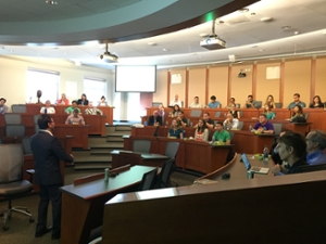 A male speaker giving a talk to a group