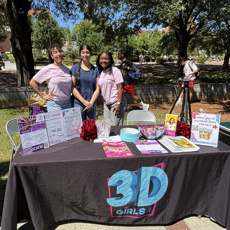 people tabling at a fair