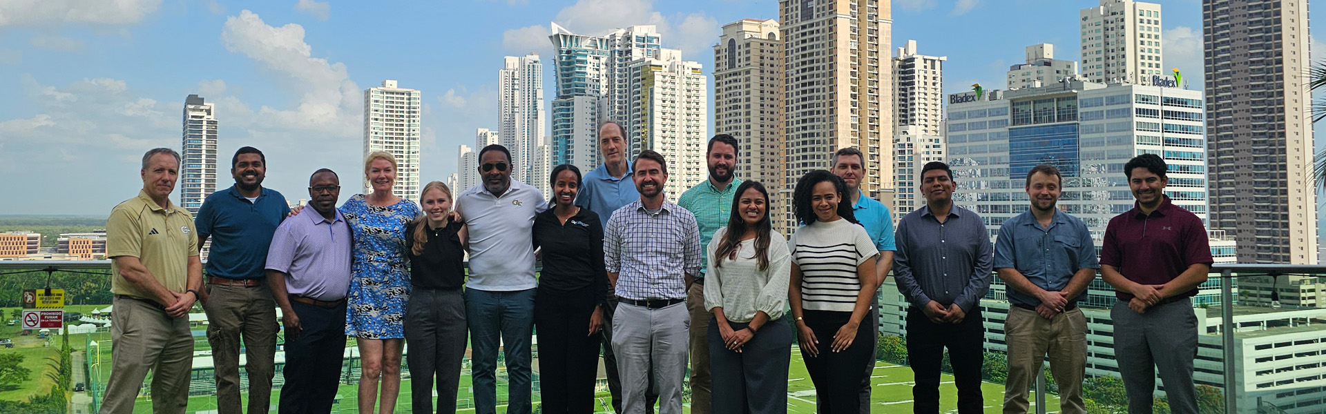 A group of diverse individuals in front of a city skyline