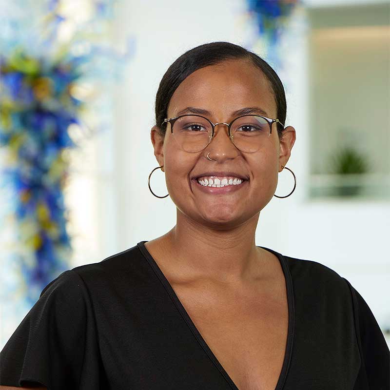 Leah Cabrera smiling for a headshot photo.