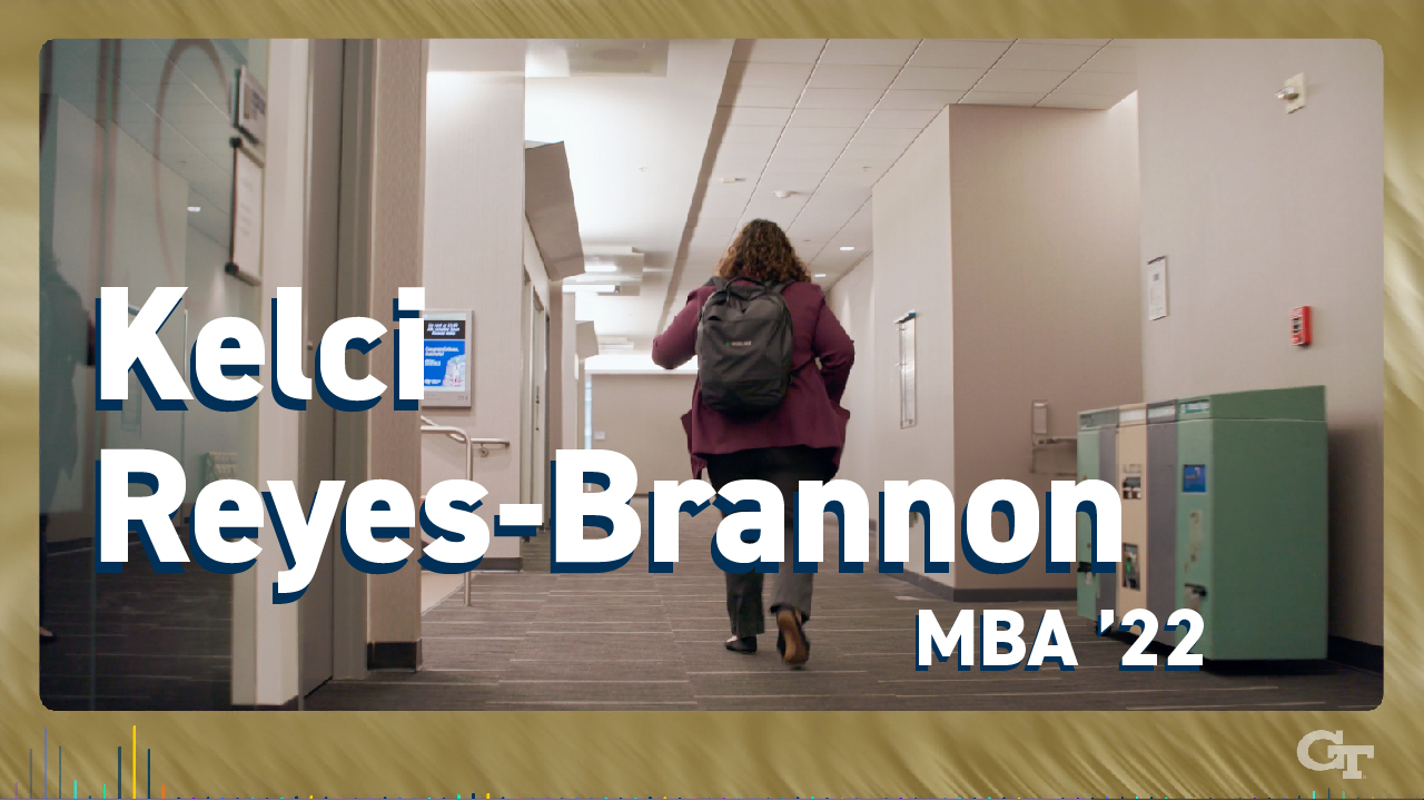 Kelci Reyes-Brannon, Evening MBA '22, walks in the Scheller College of Business