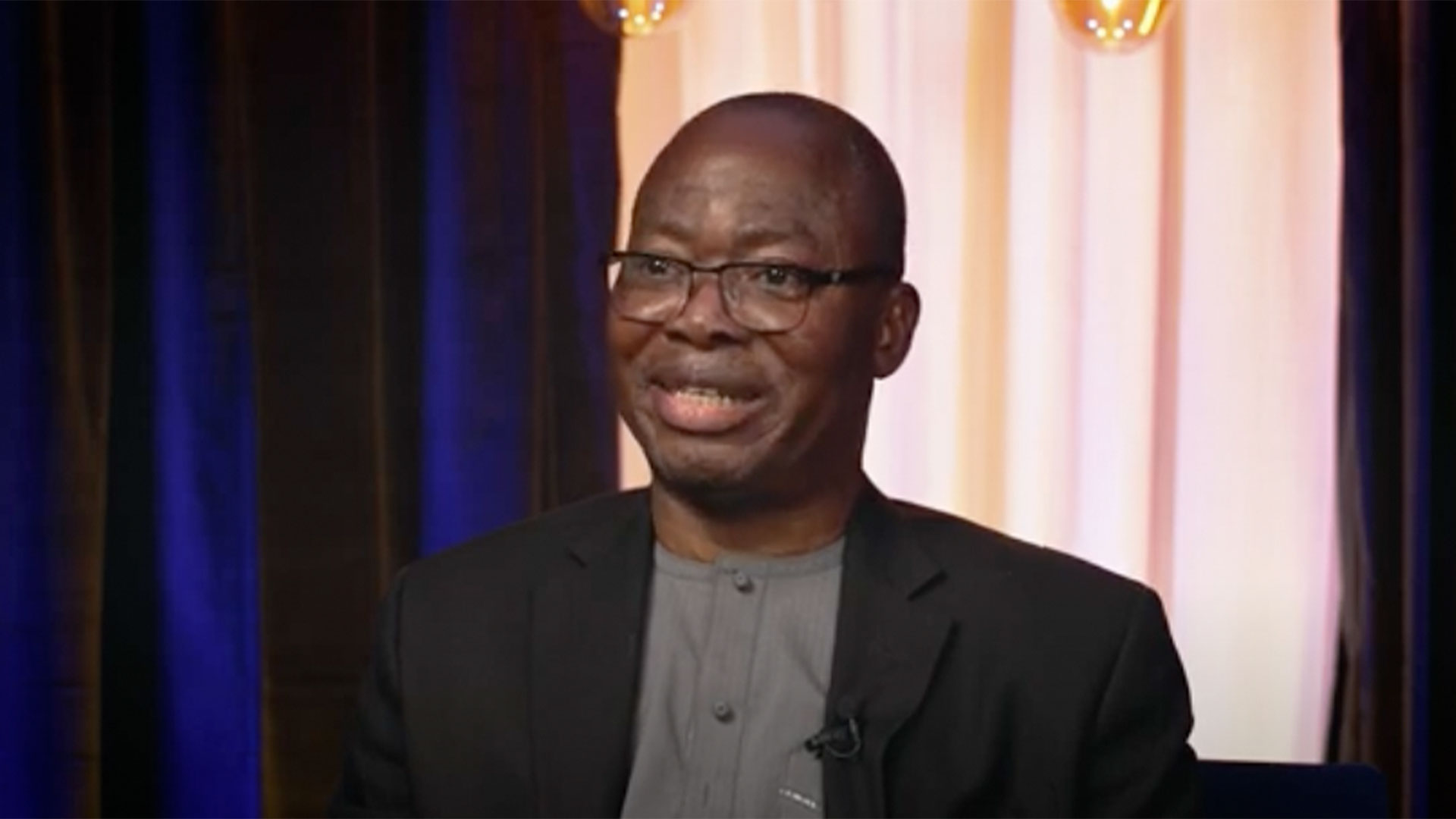 Felix Omokaro talking to camera.
