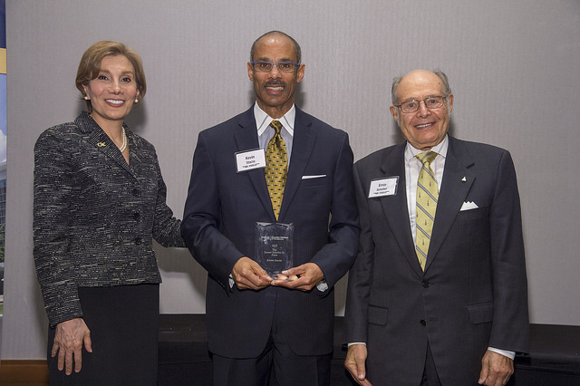 Kevin Stacia (center), Corporate Relations Manager, is awarded the Ernest Scheller, Jr. Prize by Dean Maryam Alavi (left) and Ernest Scheller, Jr. (right).