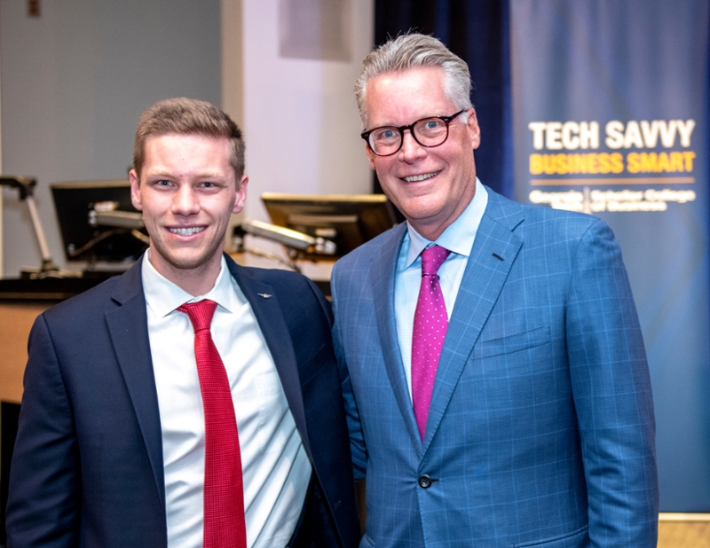 Scheller College of Business undergraduate, Travis King (l), poses with CEO of Delta Air Lines, Ed Bastian, after their interview.