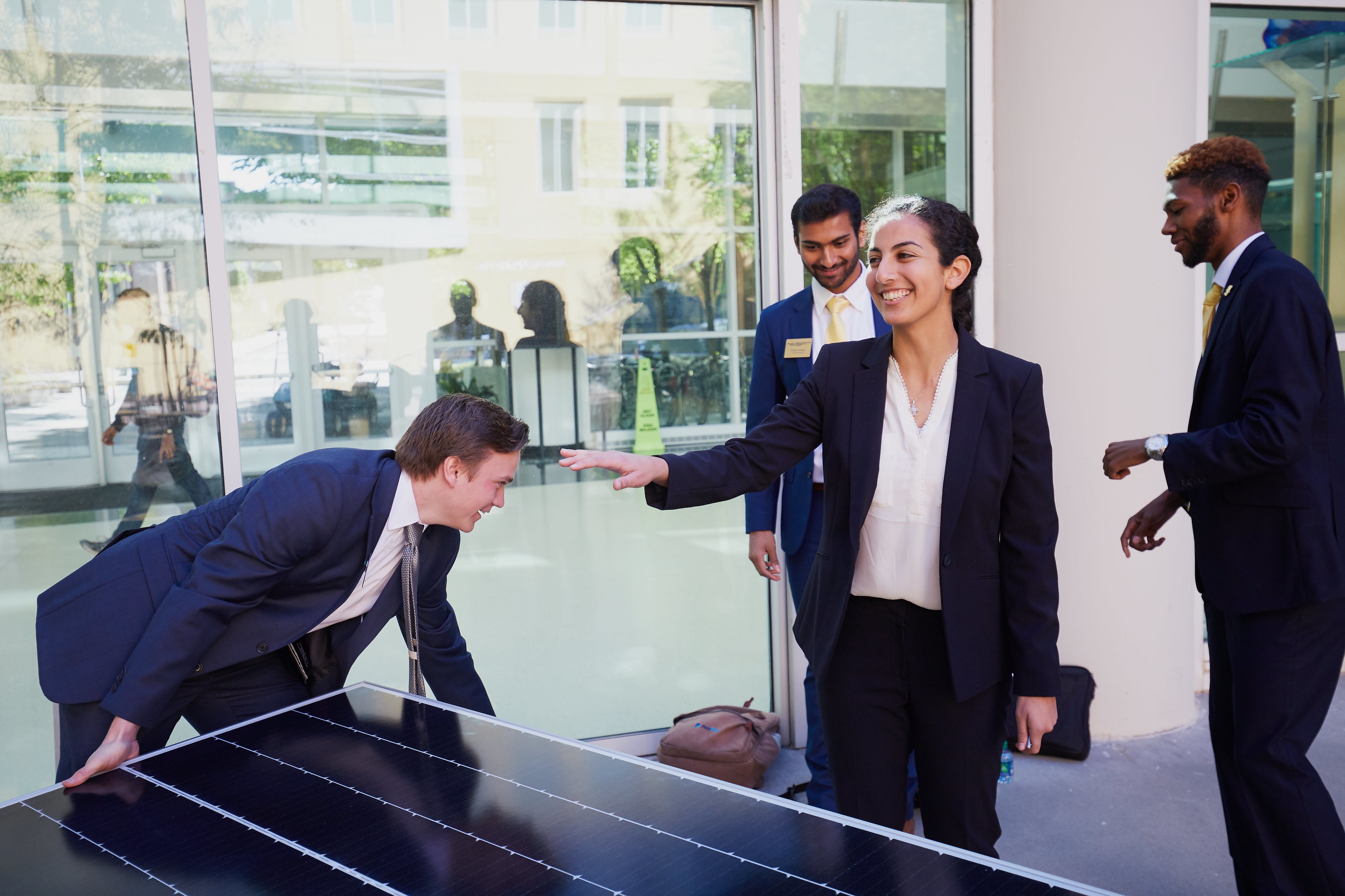 Caterpillar T&M team members set up their prototype of a portable photovoltaic cell system.