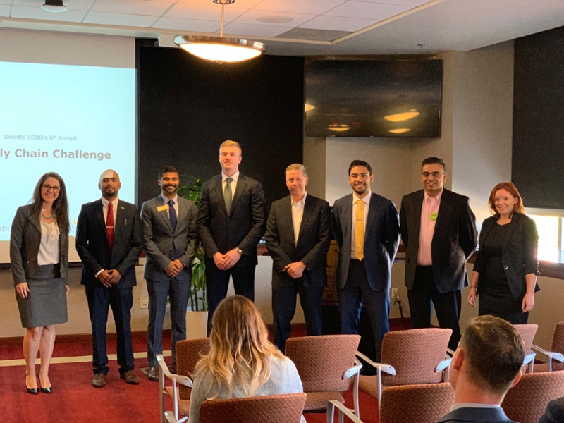 Scheller first-year, Full-time MBA students Subhachandhar Shanmugasundaram (second from left), Mihir Chheda (third from left), Bradley Gunter (fourth from left), and Osama Mikawi (third from right) competed in the 6th Annual Deloitte SCNO Supply Chain Challenge.