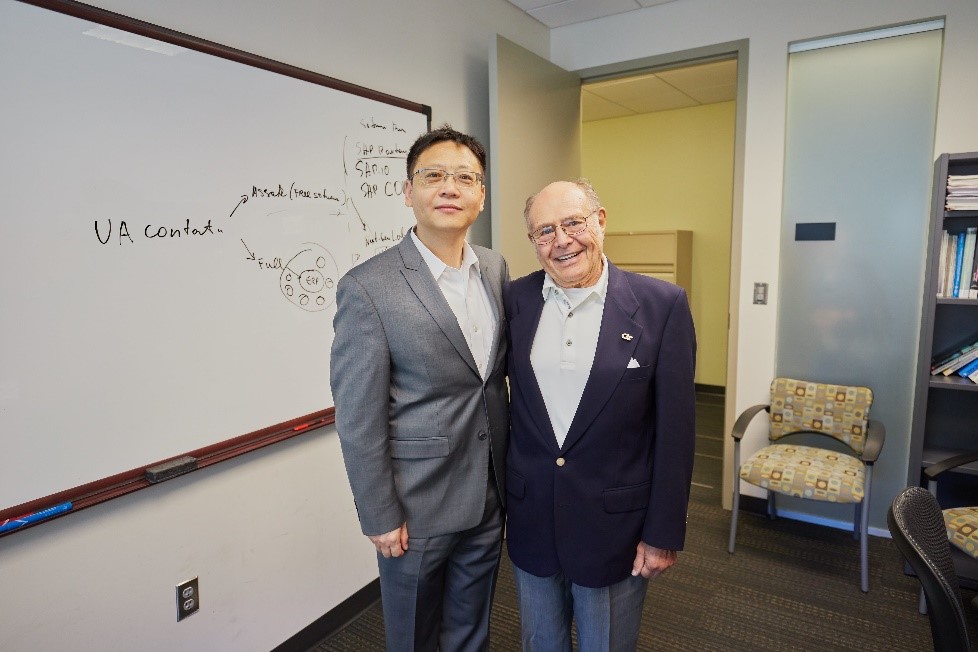 Professor DJ Wu (left), the Ernest Scheller, Jr. Chair in Innovation, Entrepreneurship, and Commercialization, meets the namesake of his chair, Mr. Scheller (right).