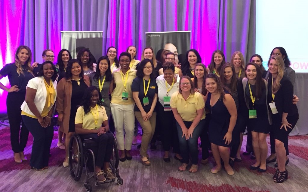 Scheller attendees pose in the conference's main ballroom.