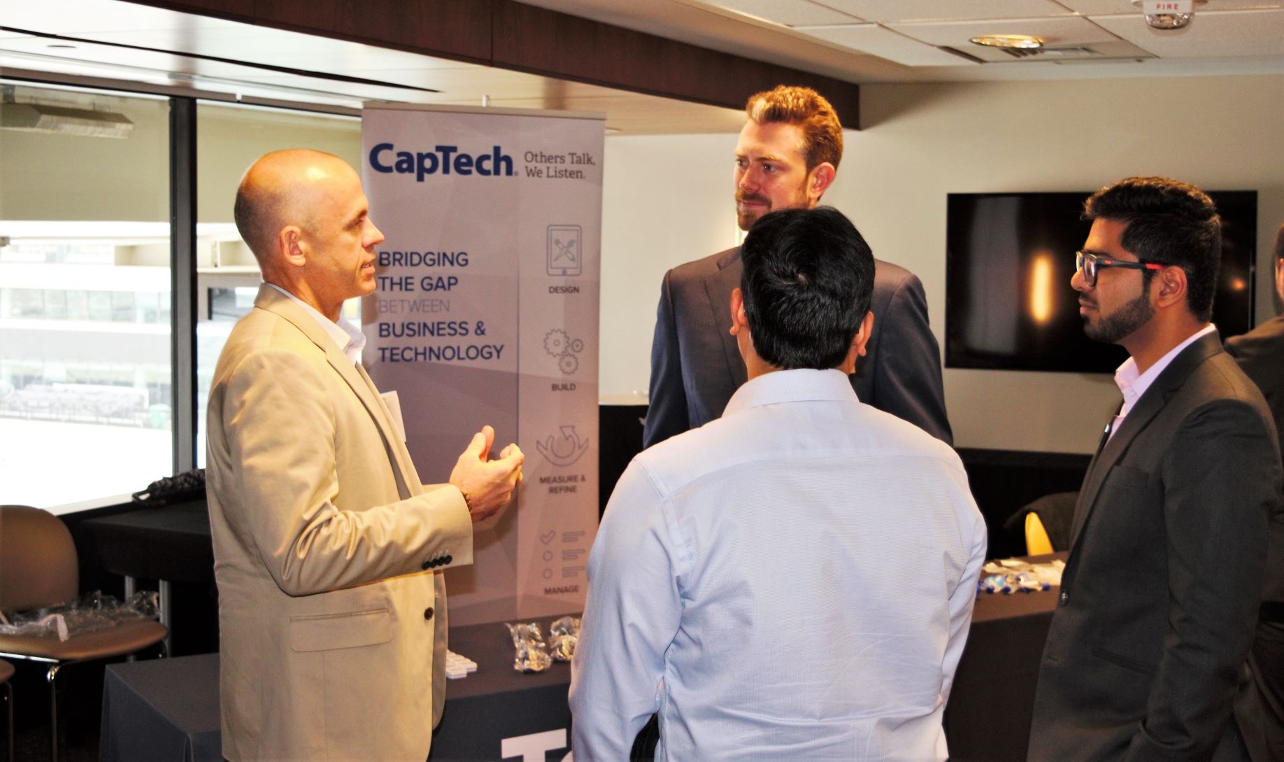 Students meet with a CapTech representative.