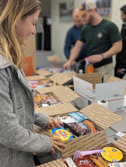MBA students compile care packages to send to deployed troops in observance of Veterans Day 2018.