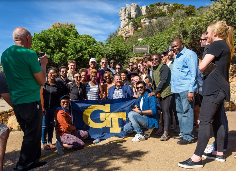 MBA students pose with civil rights legend Andrew Young in the Cape of Good Hope.