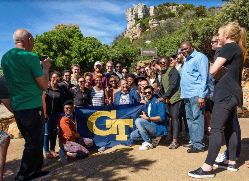 MBA students pose with civil rights legend Andrew Young in the Cape of Good Hope.