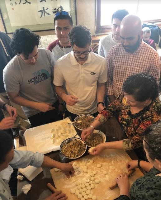 The MBA international practicum participants learn how to make dumplings.