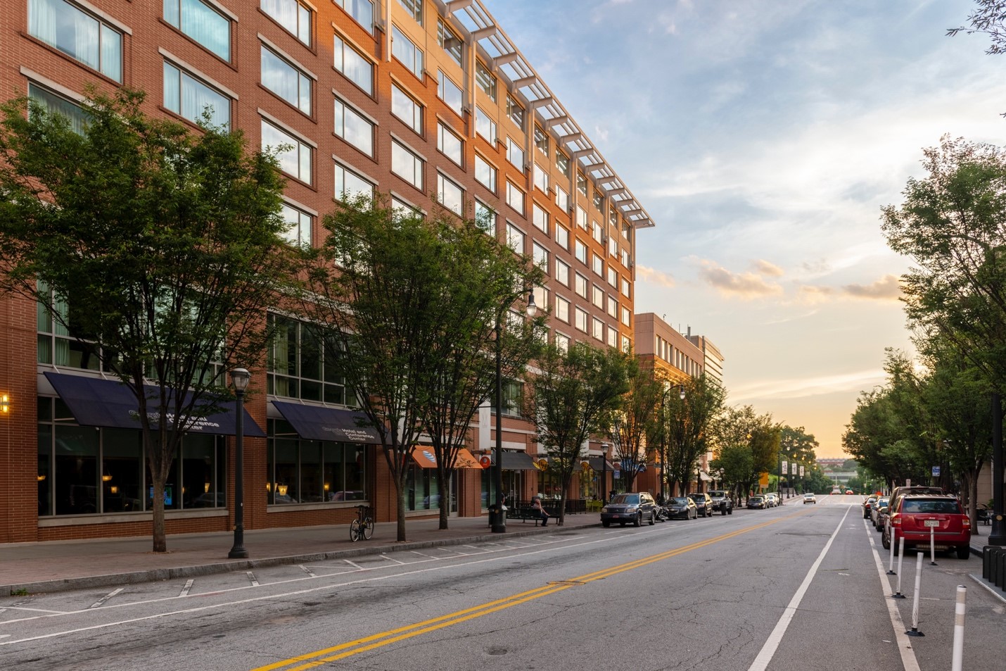 The sun sets on 5th Street after a long day of bustling activity.