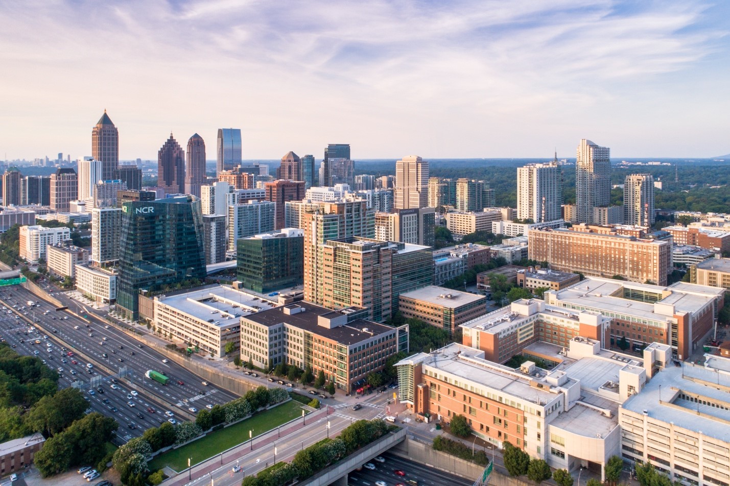 Aerial photo of pedestrian bridge and buildings