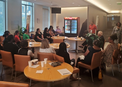 Group of people around tables