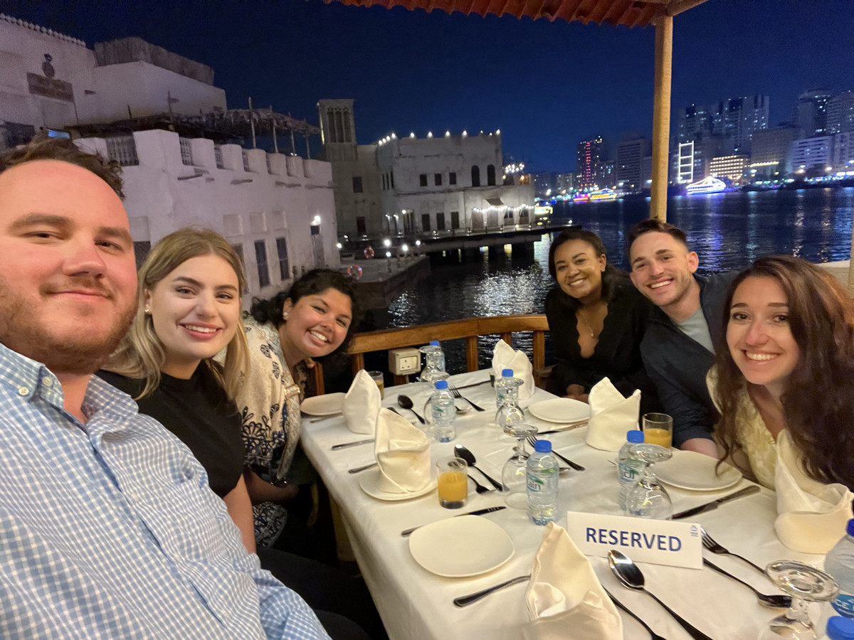 A group of students at a dinner table in Dubai