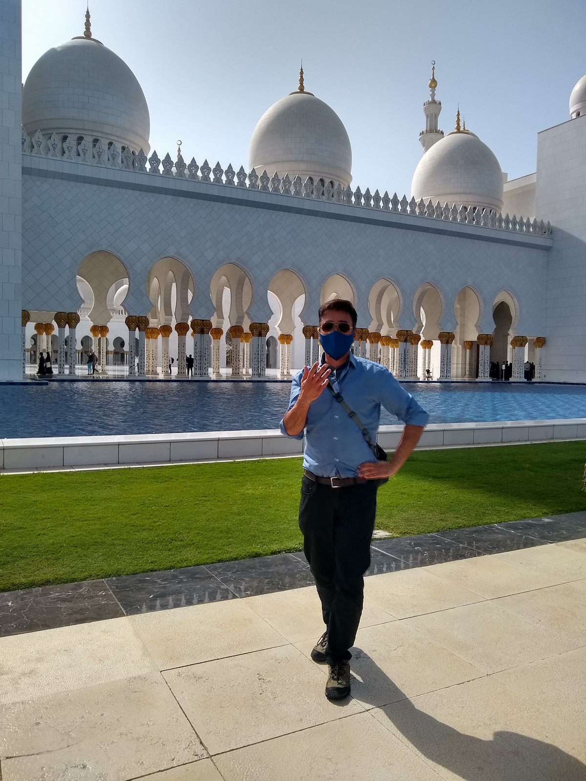 A man stand outside of a white building