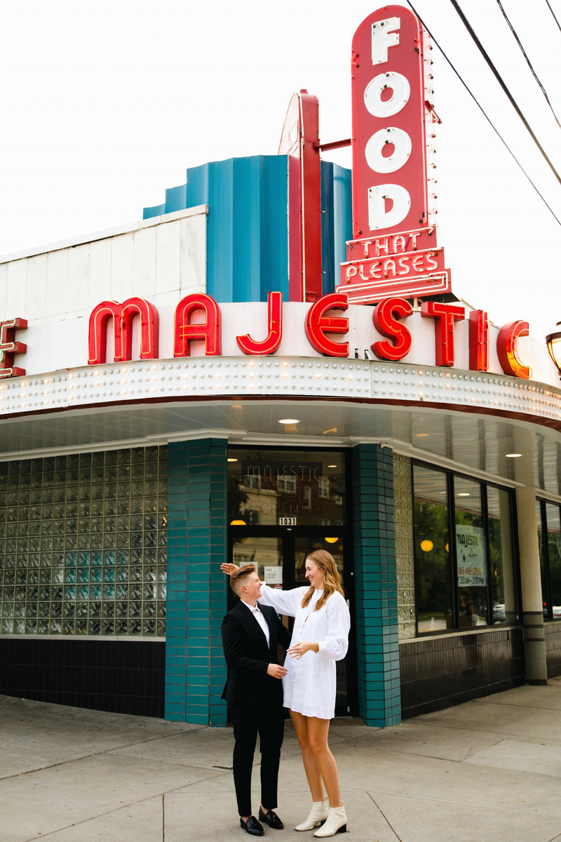 A photo of two people standing outside a building