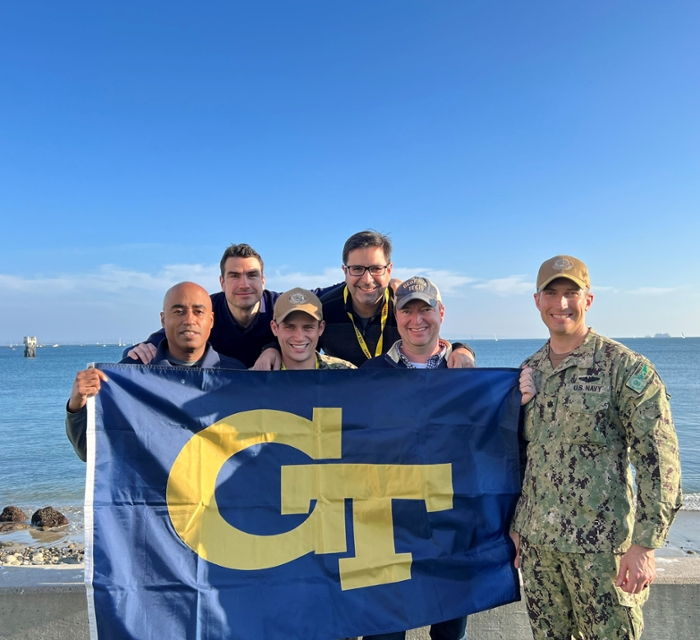 Left to right: Stephen Ruffin (AE), Juergen Rauleder (AE), Lt. Jacob Rothstein of the U.S. Navy, Julian Rimoli (AE), John Stanford (Denning T&M), Commander Ken Kirkwood of the U.S. Navy