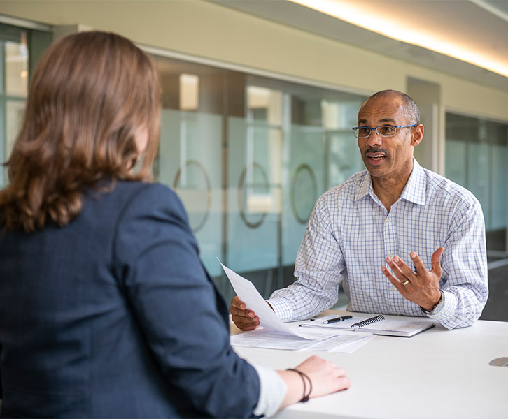 Jones MBA Career Center coach Kevin Stacia works with a Scheller MBA student.