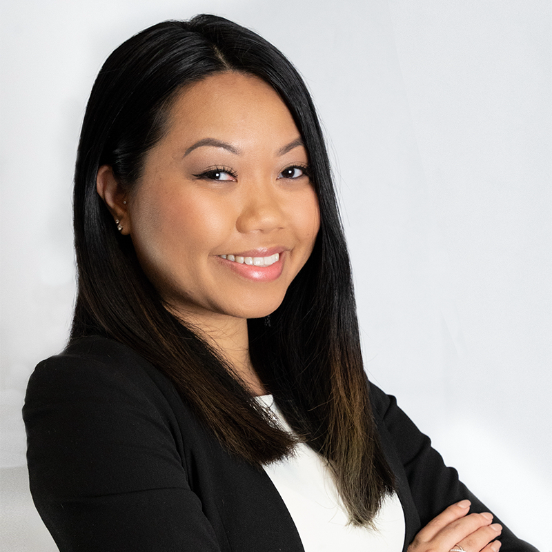 Awonda Luangphasombath, Evening MBA ‘23, stand with her arms folded in a black blazer 