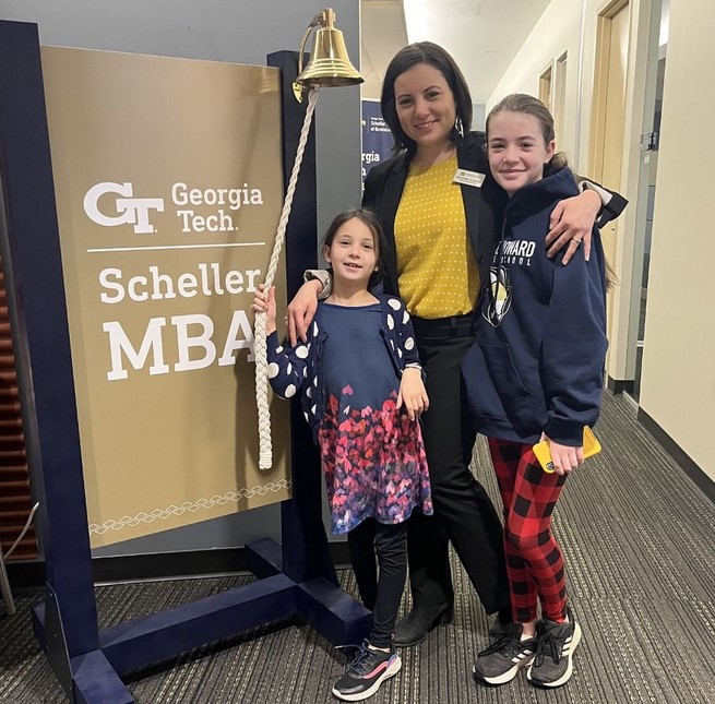 Mom ringing bell with children