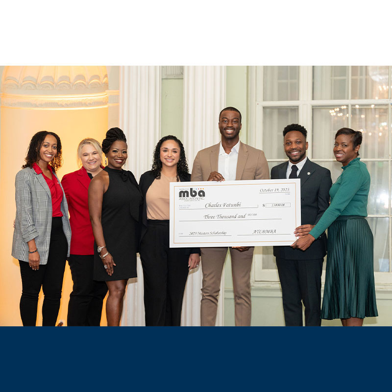 Scheller staff and MBA students posing for picture at NBMBAA award ceremony.