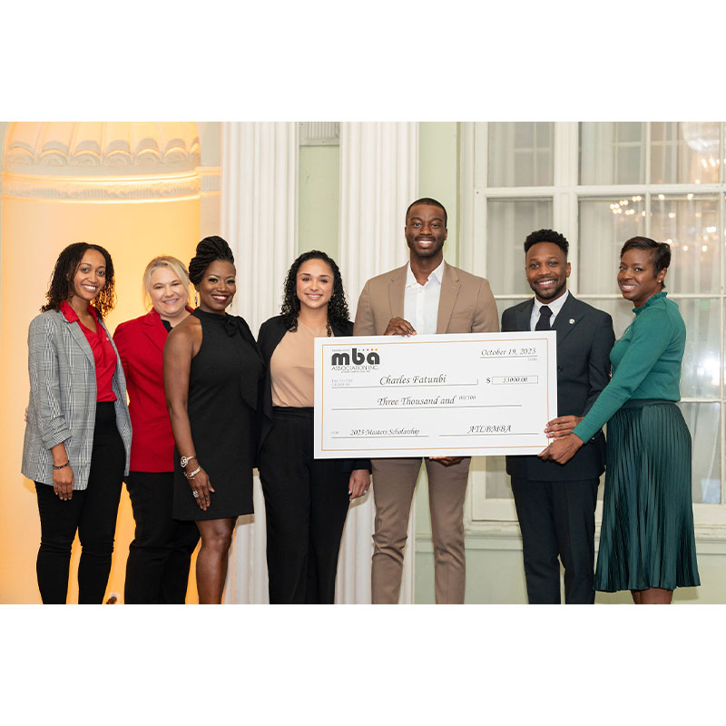 Scheller staff and MBA students posing for picture at NBMBAA award ceremony.