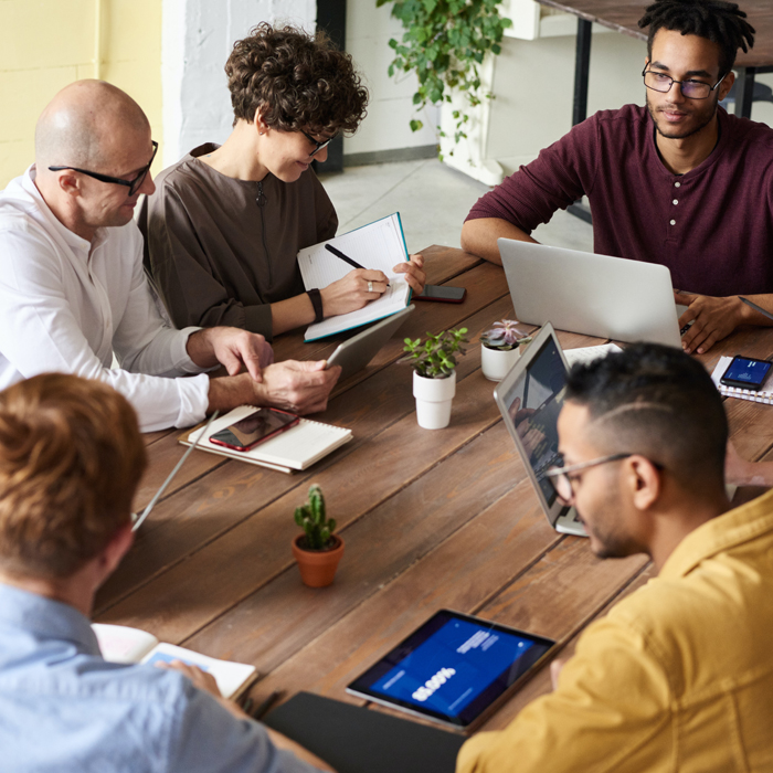 diverse group of people sitting around a table