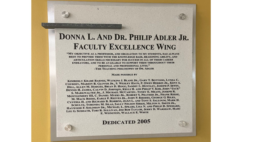 Dedication plaque for the Faculty Excellence Wing in the Scheller College of Business, made possible by friends of Donna L. and Dr. Philip Adler Jr.