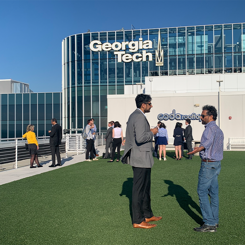 Sudheer Chava speaks with Jay Raol on the grassy rooftop of the CODA building next to the Scheller College of Business.