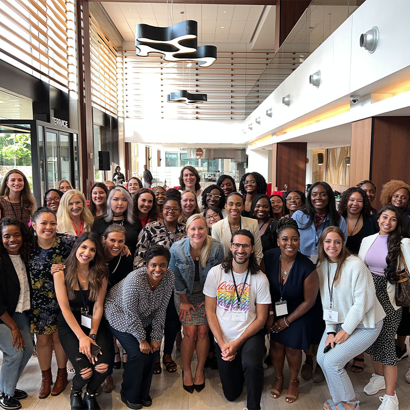 A group of young professional women gather at a WIT event 