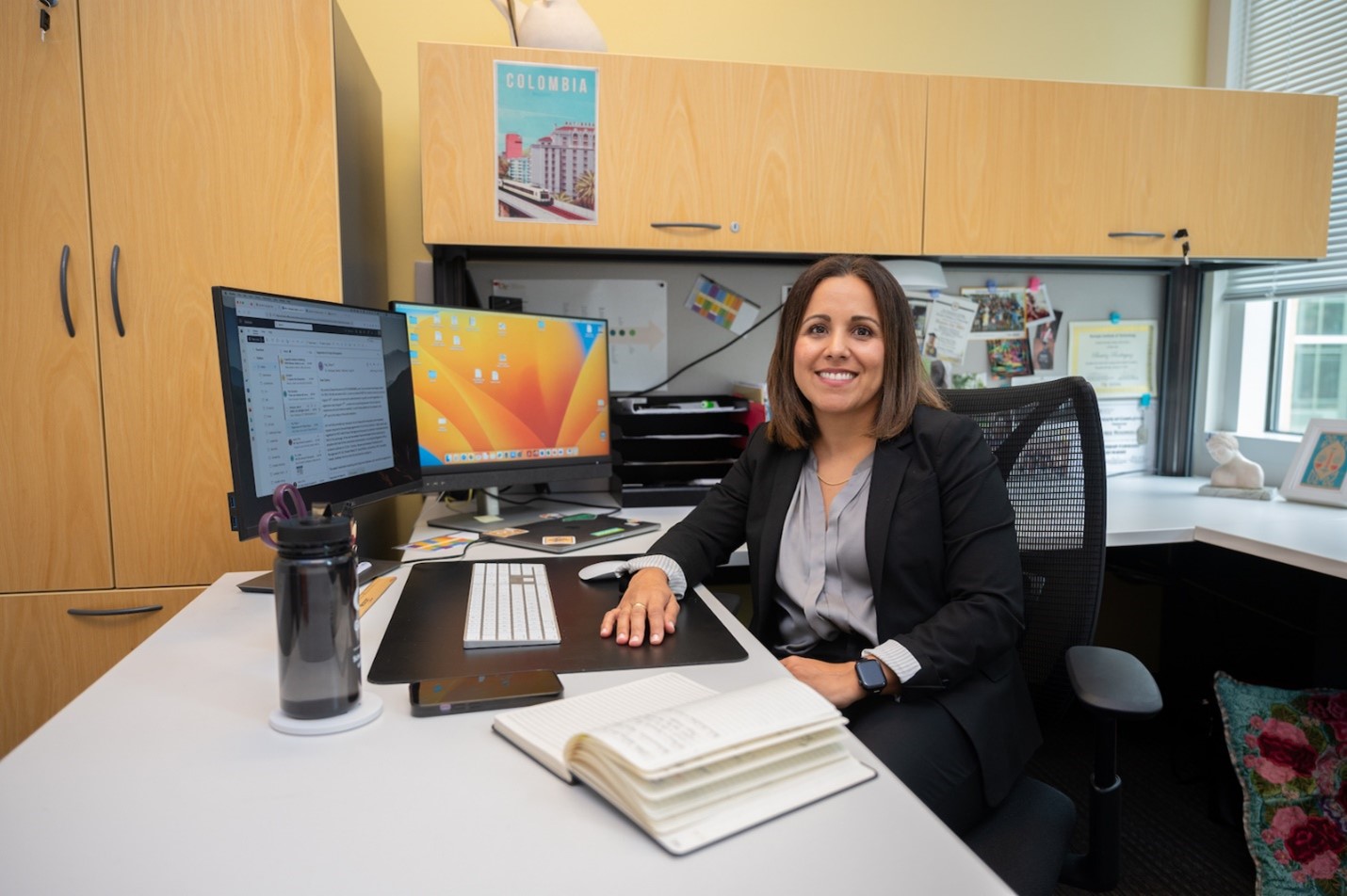 Beatrice Rodriguez at desk.
