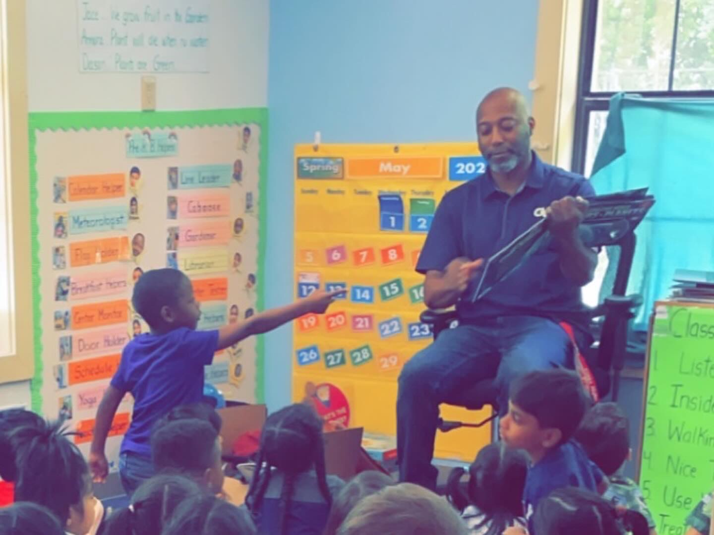 Jay Elliott volunteering at his son's school where he hosted a "Space Day" to get the kids excited about STEM and Georgia Tech.