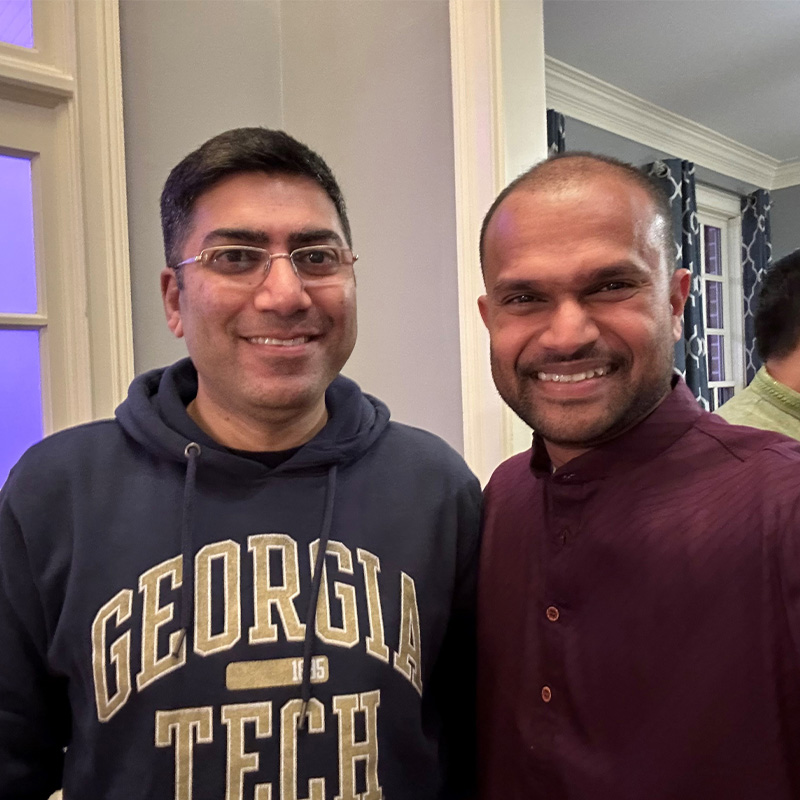 Aman Behl, Executive MBA ’24, stands smiling next to Krishna Kumar, Executive MBA ‘22    