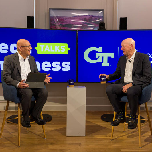 Dean Anuj Mehrotra and David Solomon, CEO of Goldman Sachs