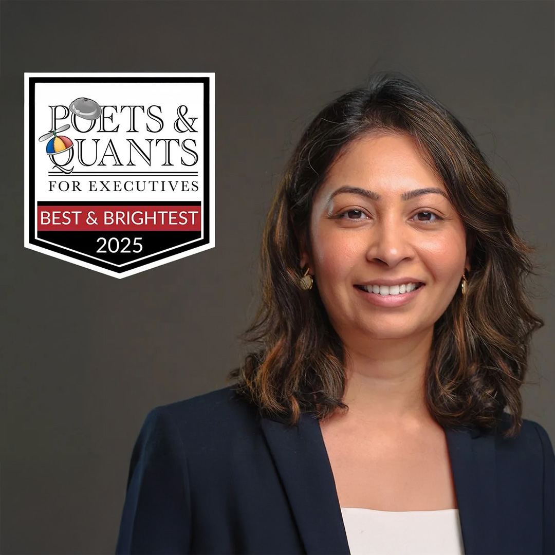 A woman smiles into the camera