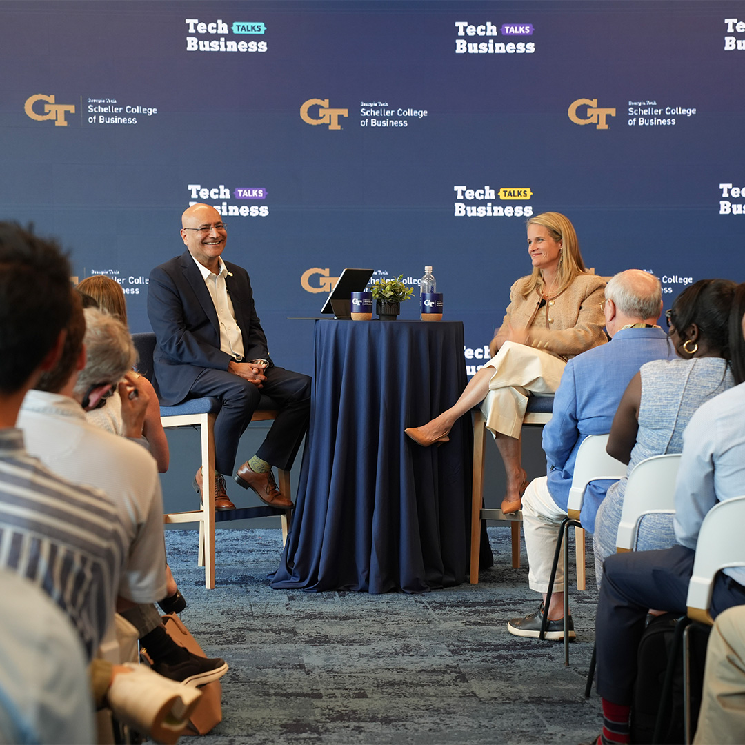 Beth Lowry talks with Anuj Mehrotra at the Cisco Systems offices in Midtown Atlanta