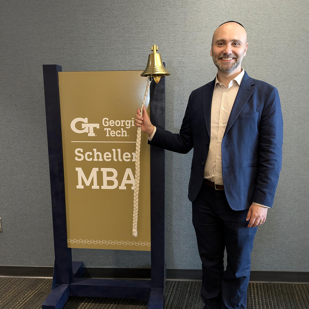 Joe Arton, new executive director of the Jones Career Center, ringing a bell
